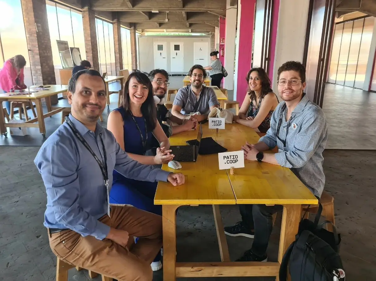 Patio members collaborating around a table