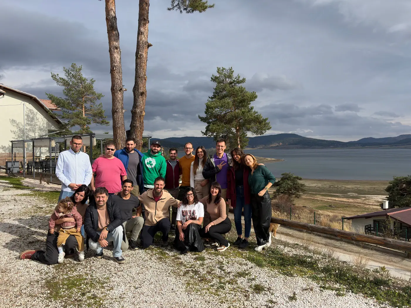 Large Patio retreat group photo in front of a lake